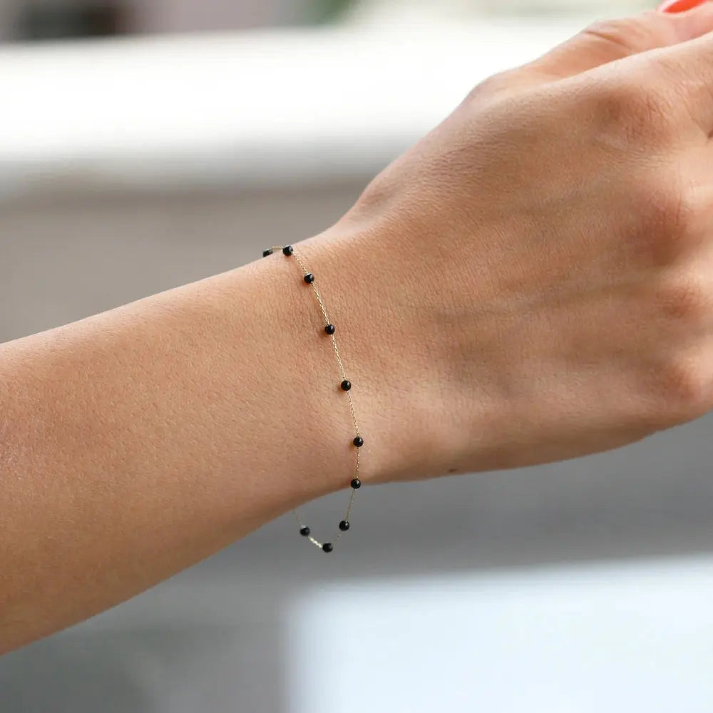 Bracelet or pierres onyx