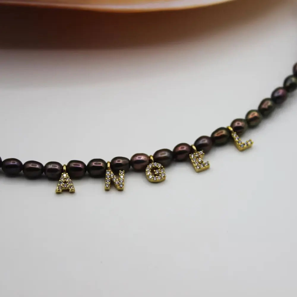 Collier perles noires prénom